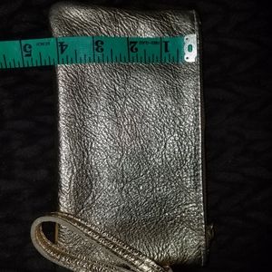 Metallic gold genuine leather wristlet bag